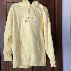Happiness project yellow sweatshirt. Size L. Never worn.